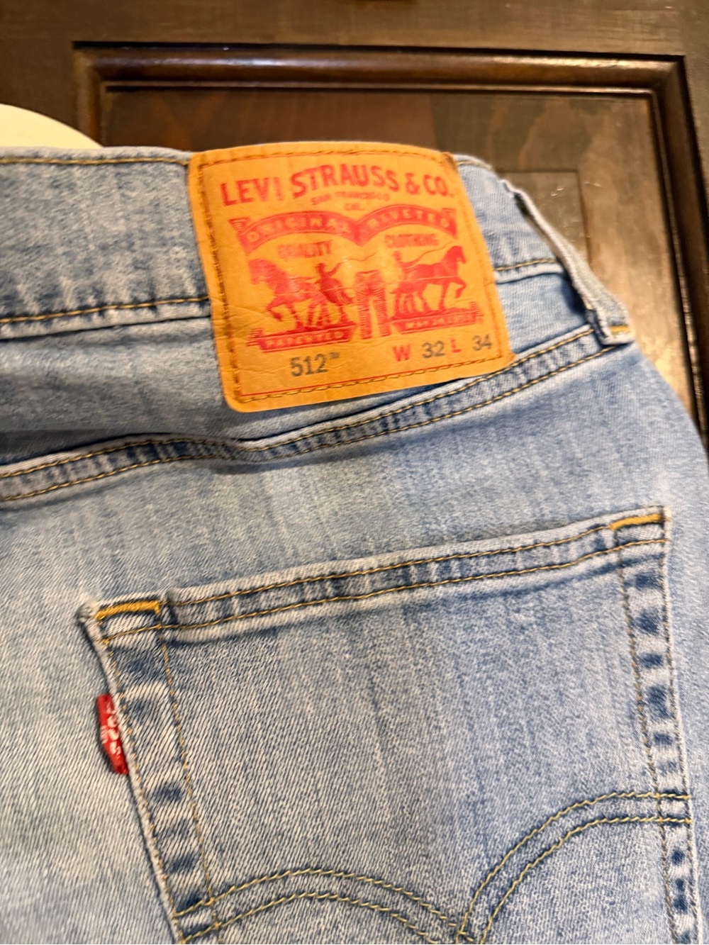 Levi's Light Blue Slim Straight Jeans with Tan Leather Patch